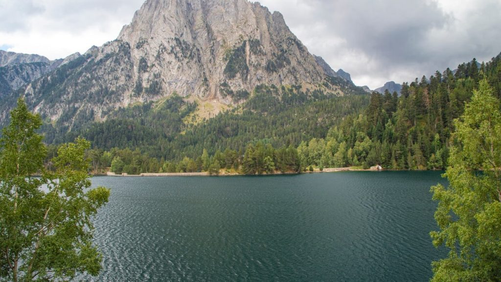 Beautiful landscape of Estany de Sant Maurici with Gran Encantat in the background, Catalonia, Spain.